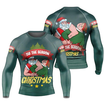 Dark green Christmas sweatshirt featuring muscular Santa play wrestling with elf and text 'Tis the Season Christmas'