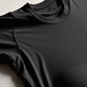 Close-up of a black compression shirt fabric highlighting smooth texture and stretch fit